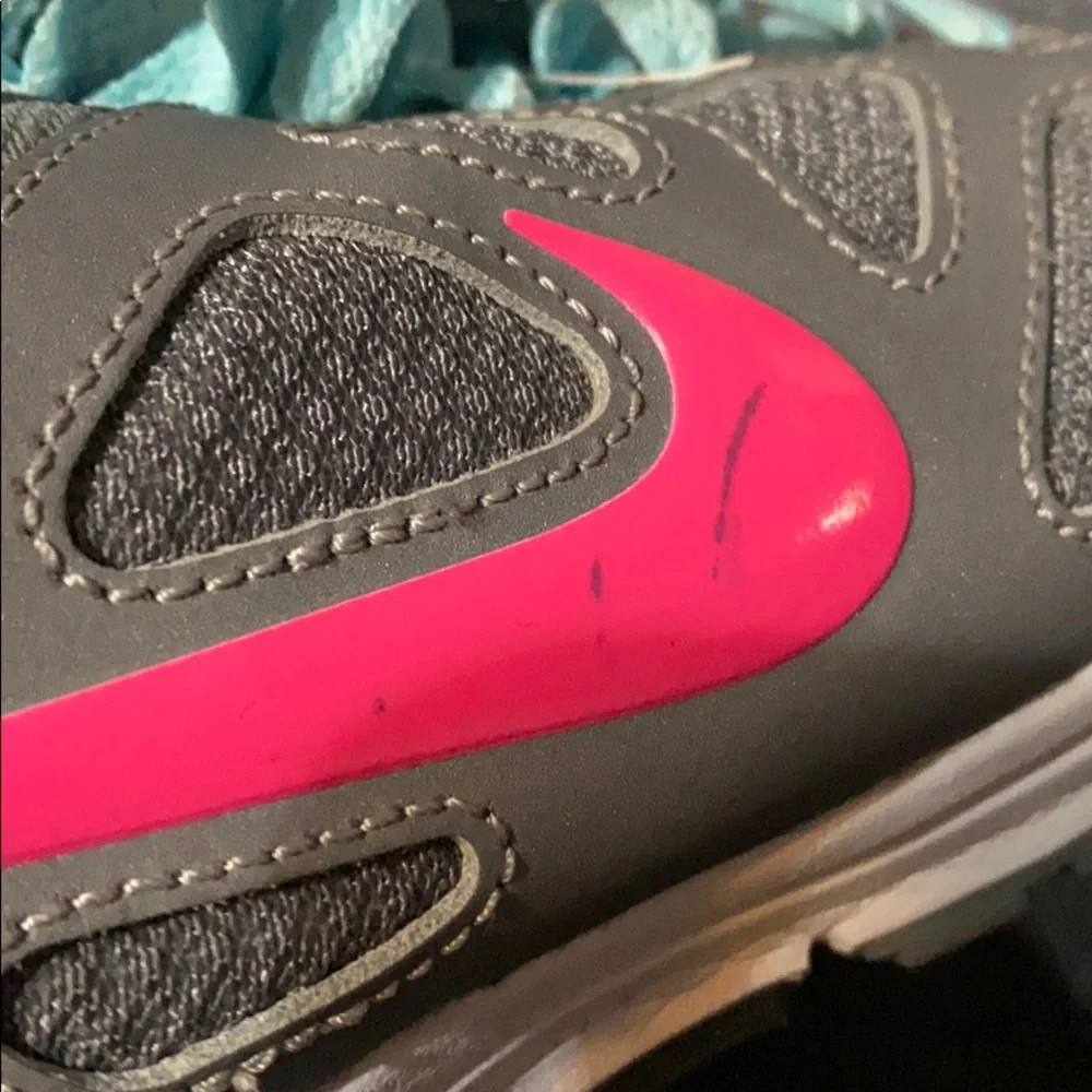 Nike Women’s Gray Athletic Shoes with Pink Swoosh and Light Blue Accents